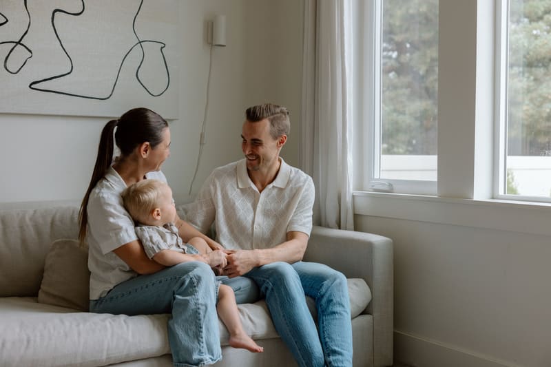 Garrett and his wife at home with their son.
